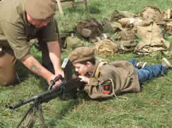 Dillon with machine gun